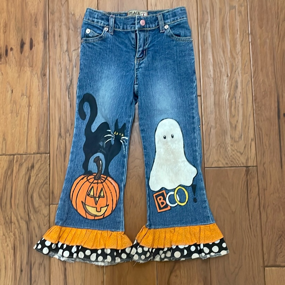 Hand painted Halloween jeans with fabric sewn to the bottom for ruffles